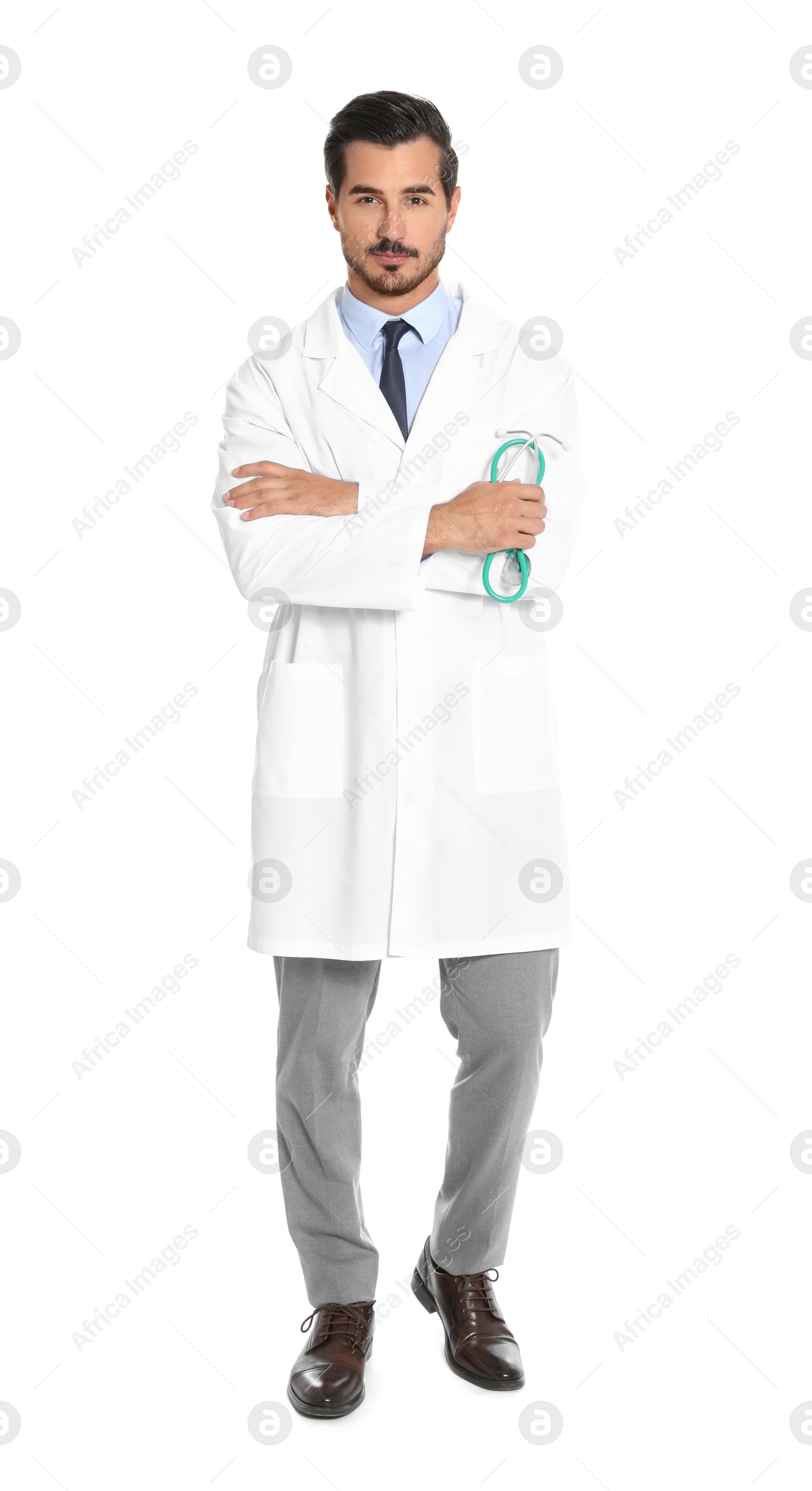 Photo of Young male doctor with stethoscope on white background. Medical service