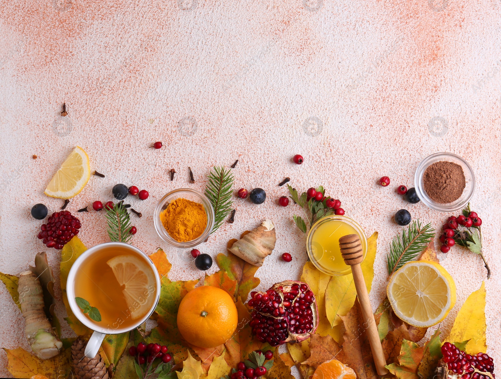 Photo of Flat lay composition with cup of delicious immunity boosting tea and ingredients on color textured background. Space for text