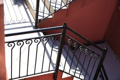 Photo of Beautiful stairs with metal handrails outdoors, above view