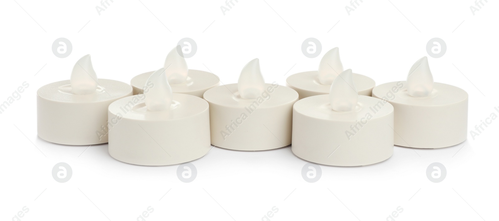 Photo of Decorative flameless LED candles on white background