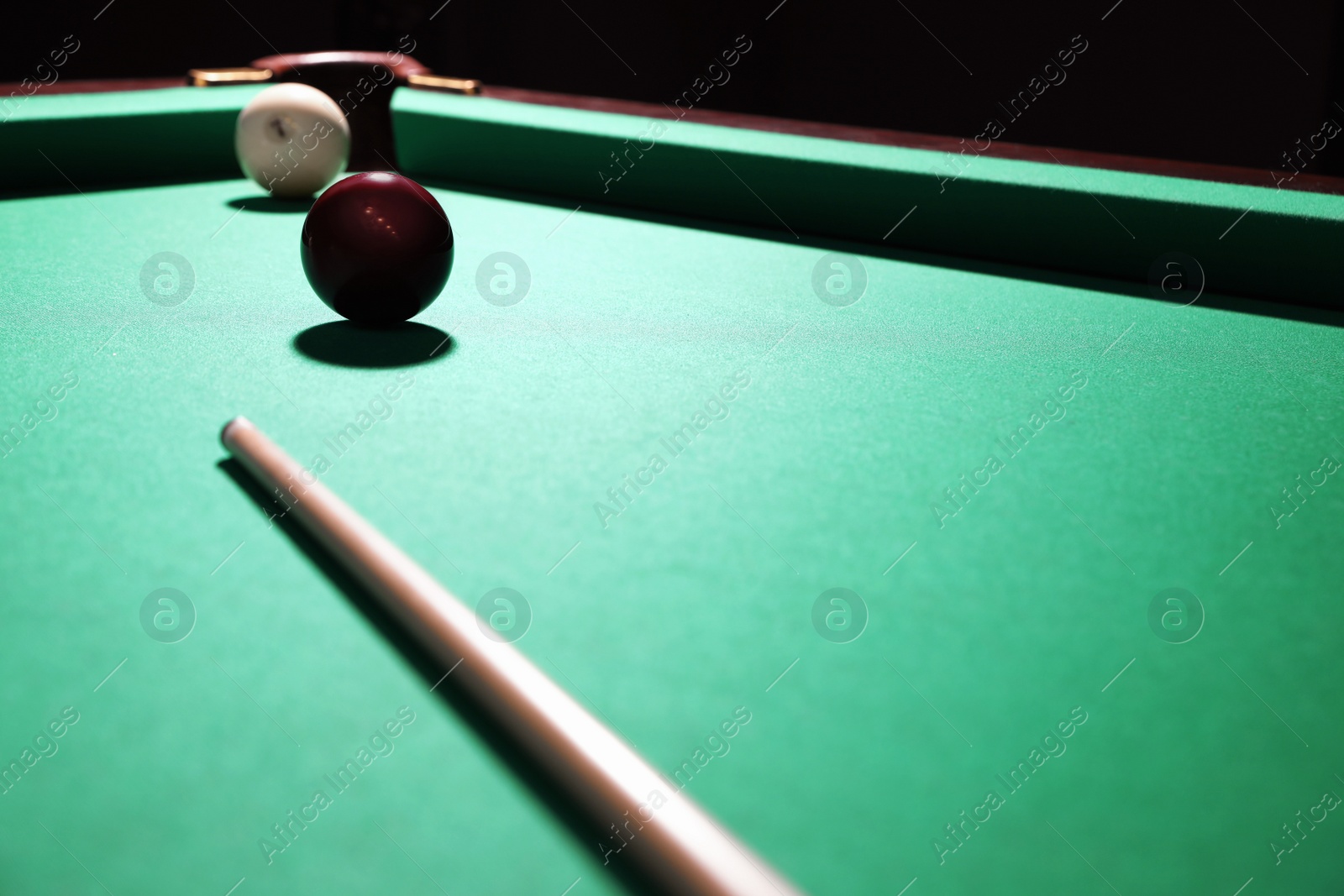 Photo of Billiard balls and cue on table. Space for text