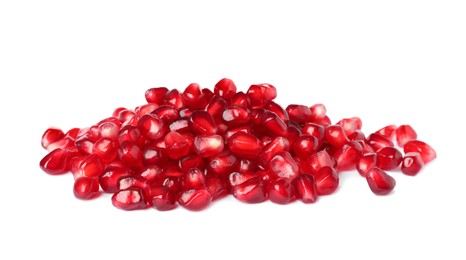 Pile of tasty pomegranate seeds on white background