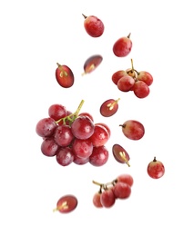 Image of Fresh ripe grapes falling on white background