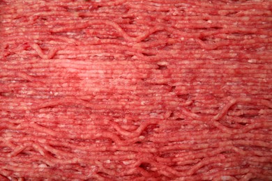 Photo of Raw fresh minced meat as background, closeup view