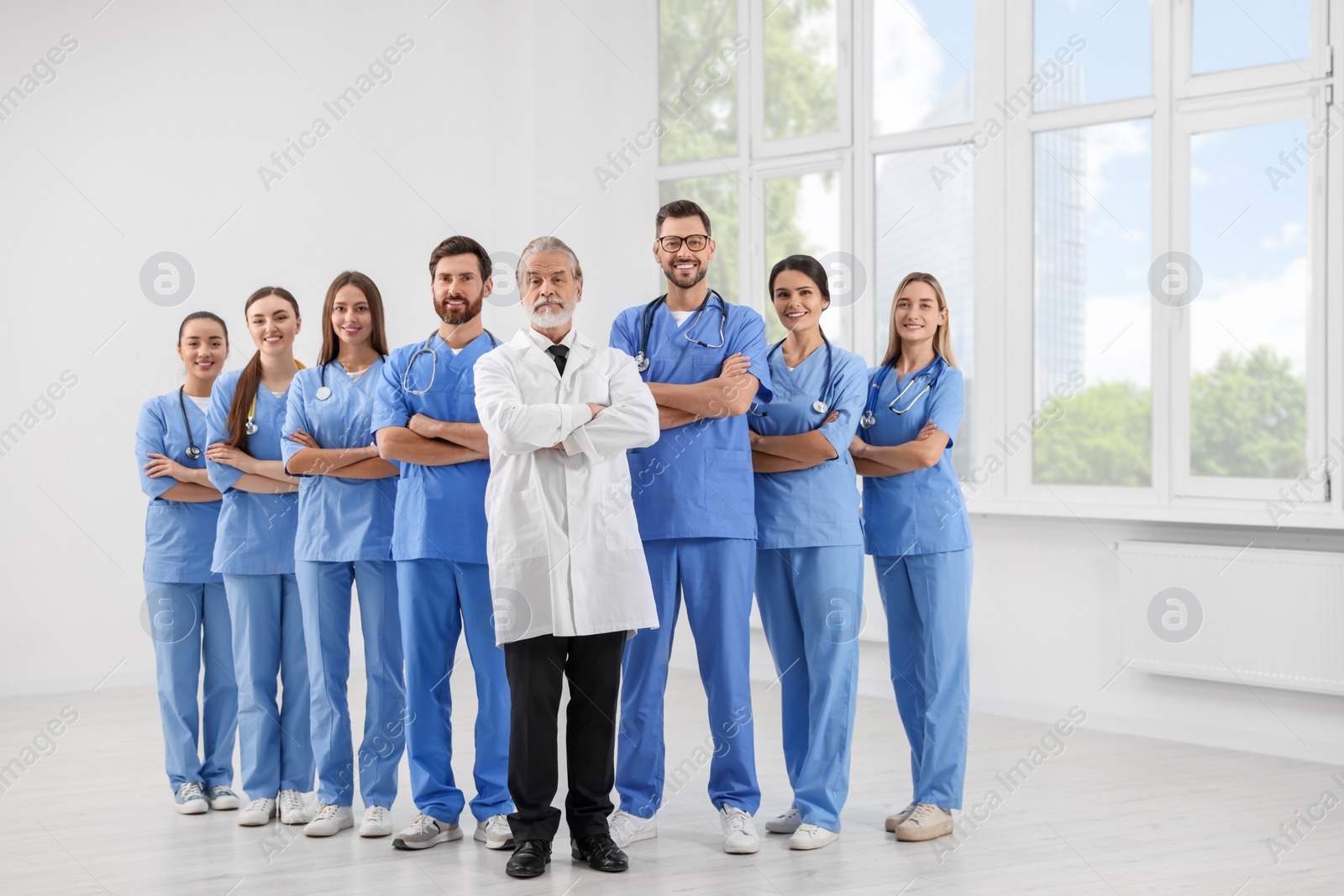 Photo of Doctor and his colleagues in hospital. Medical service