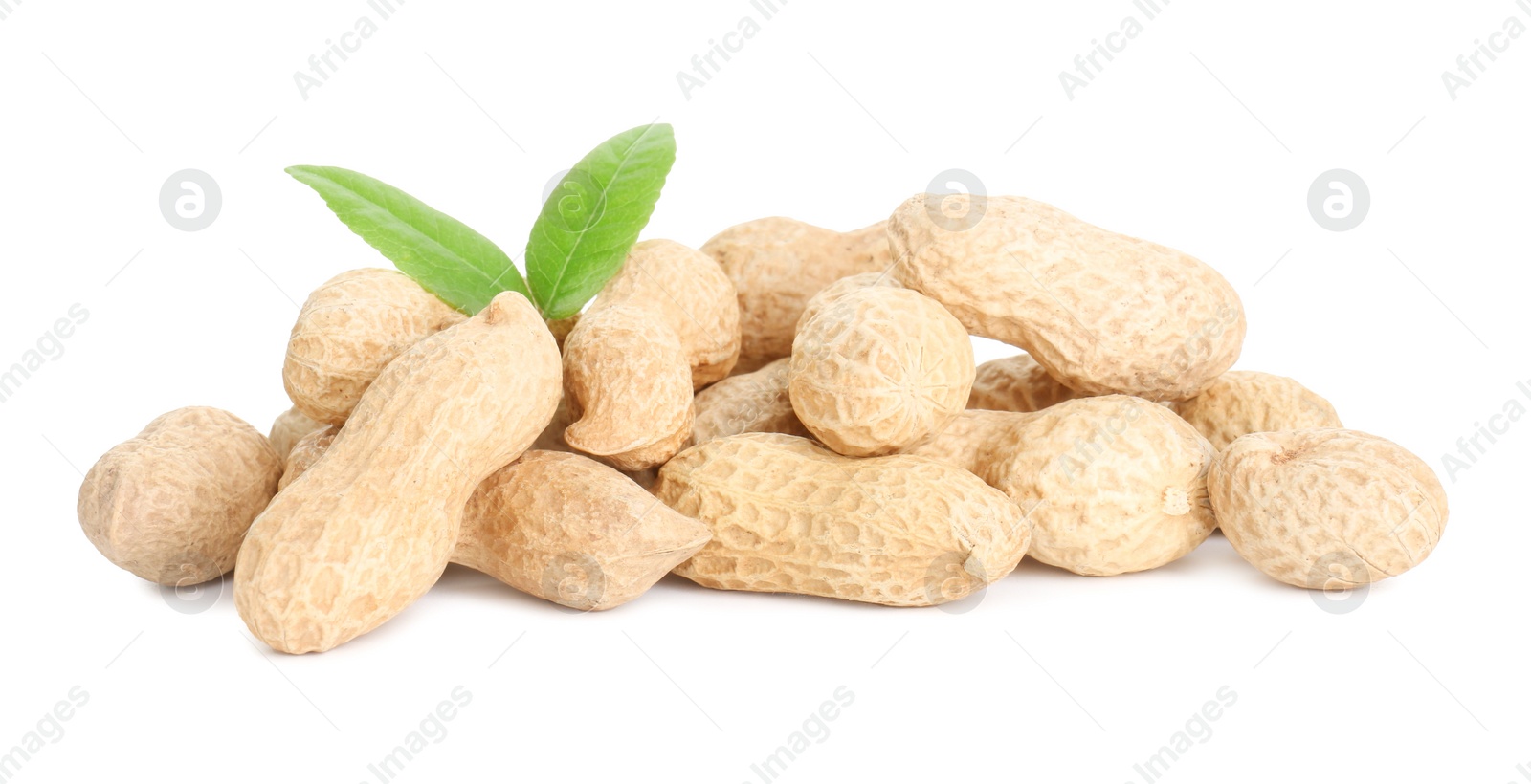 Photo of Fresh unpeeled peanuts and green leaves isolated on white