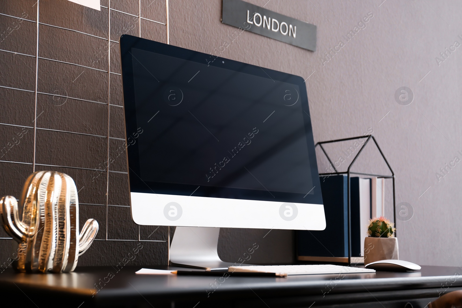 Photo of Comfortable workplace with computer on desk in home office