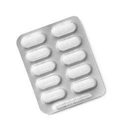 Photo of Calcium supplement pills in blister pack on white background, top view