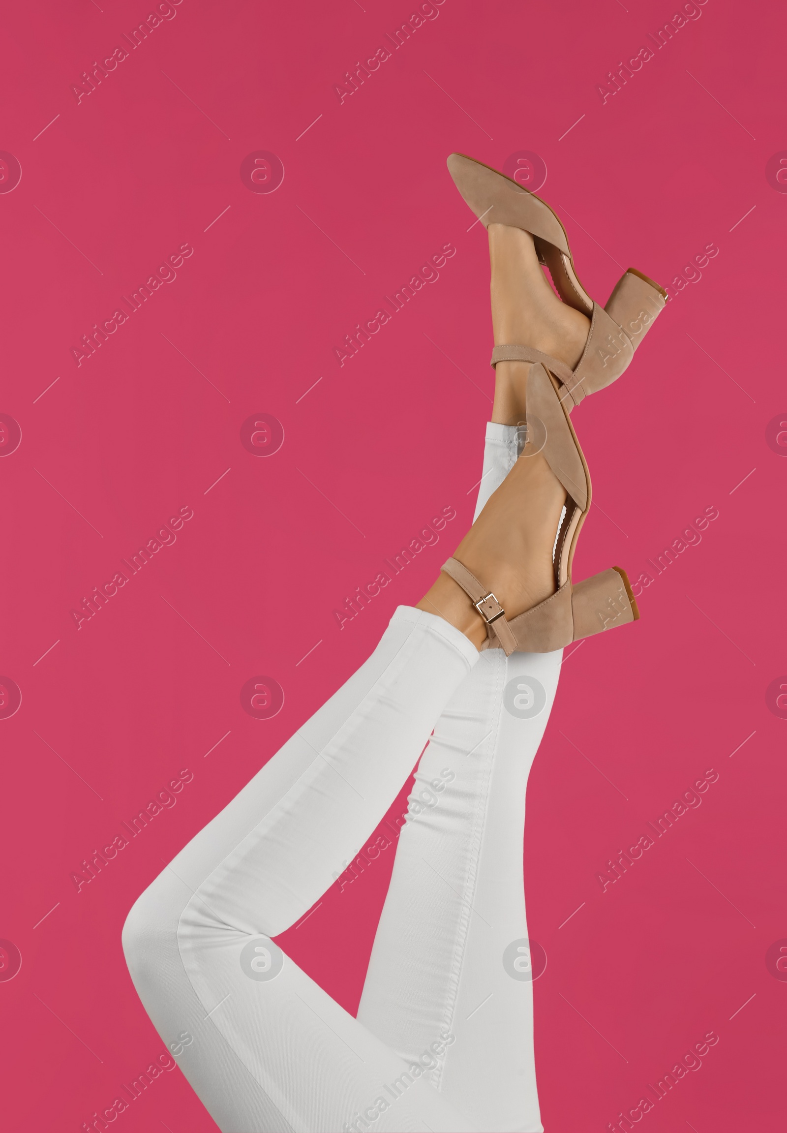 Photo of Woman wearing stylish shoes on pink background, closeup