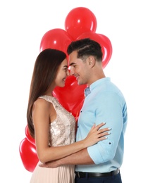 Beautiful couple with heart shaped balloons on white background