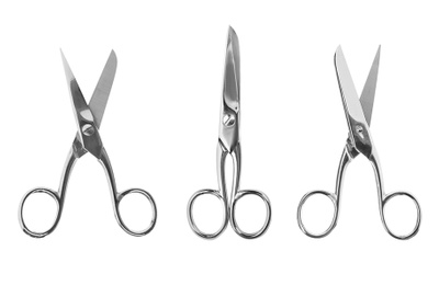 Set of sharp sewing scissors on white background, top view