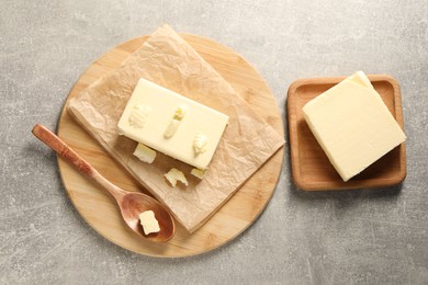 Photo of Tasty butter on grey table, top view