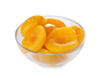 Photo of Bowl with halves of canned peaches on white background