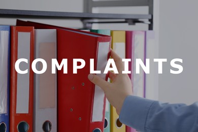 Complaints archive. Woman taking folder with documents from shelf, closeup