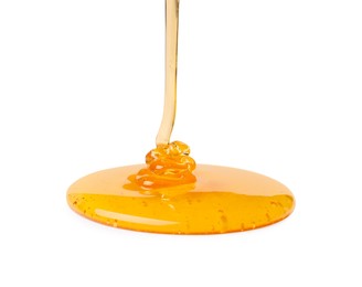 Photo of Pouring tasty natural honey isolated on white