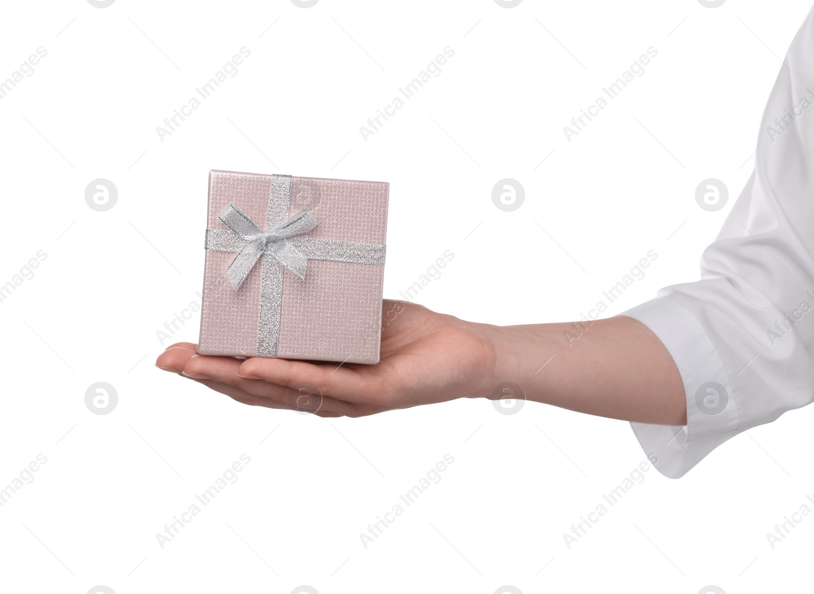 Photo of Doctor holding gift box on white background, closeup. Medical present