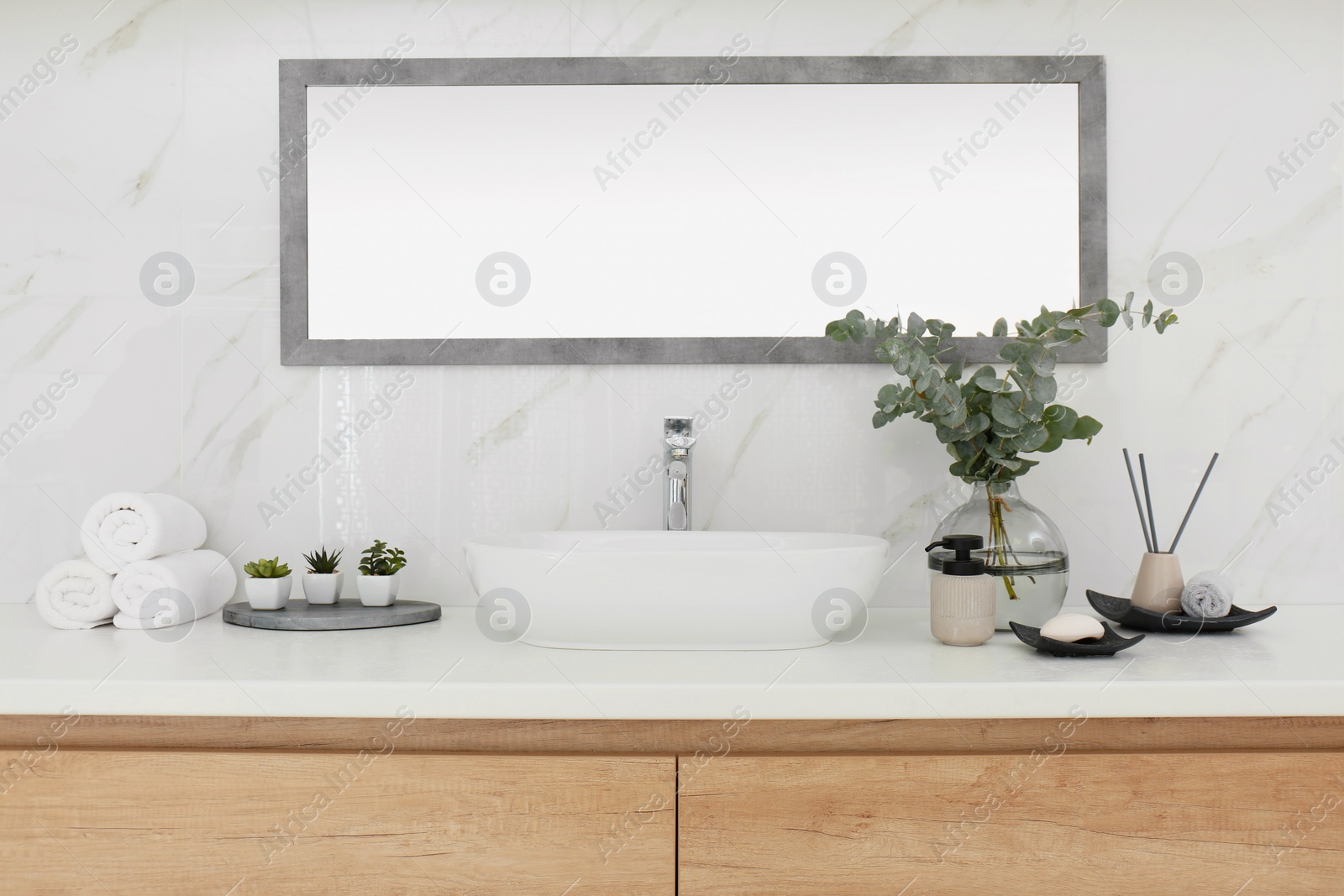 Photo of Modern bathroom interior with stylish mirror and vessel sink