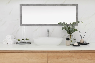 Modern bathroom interior with stylish mirror and vessel sink