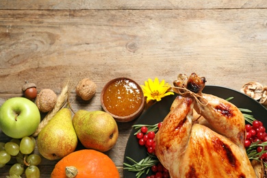 Flat lay composition with turkey on wooden background, space for text. Happy Thanksgiving day
