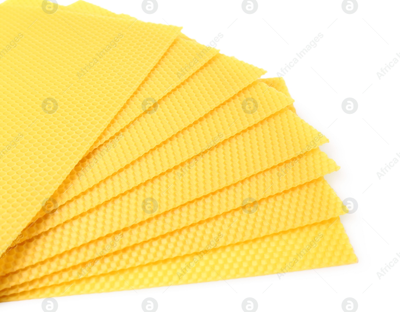 Photo of Natural organic beeswax sheets on white background