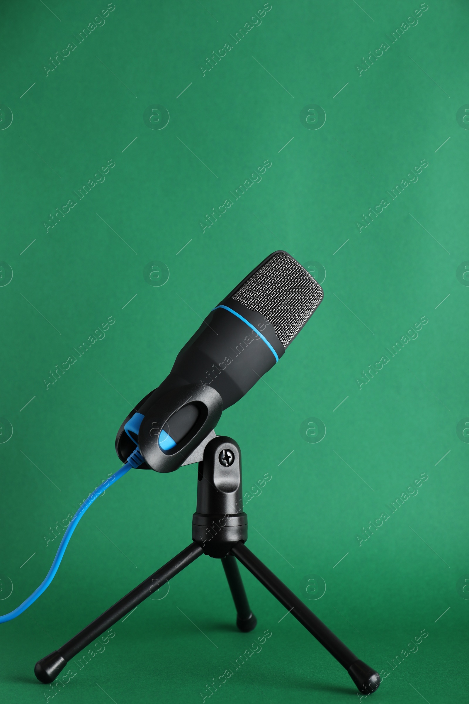 Photo of Condenser microphone on color background. Professional audio equipment