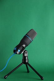 Photo of Condenser microphone on color background. Professional audio equipment