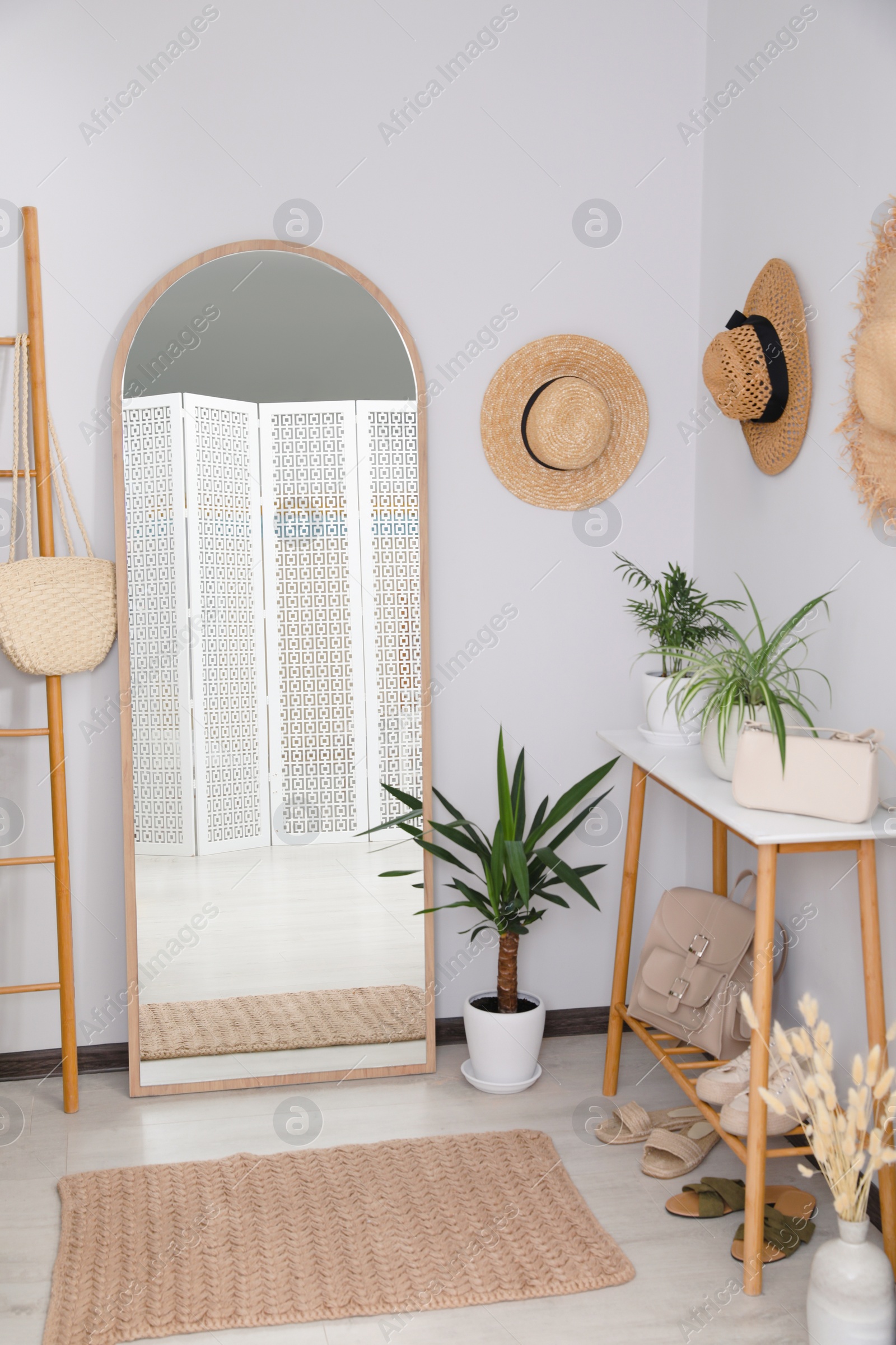 Photo of Hallway interior with stylish furniture and floor mirror