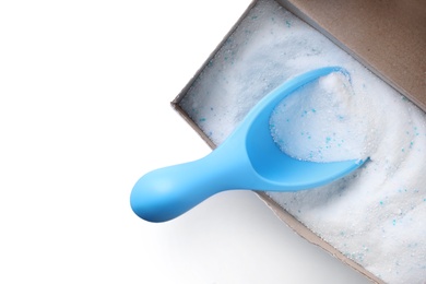 Photo of Open box with laundry powder and measuring scoop isolated on white, top view