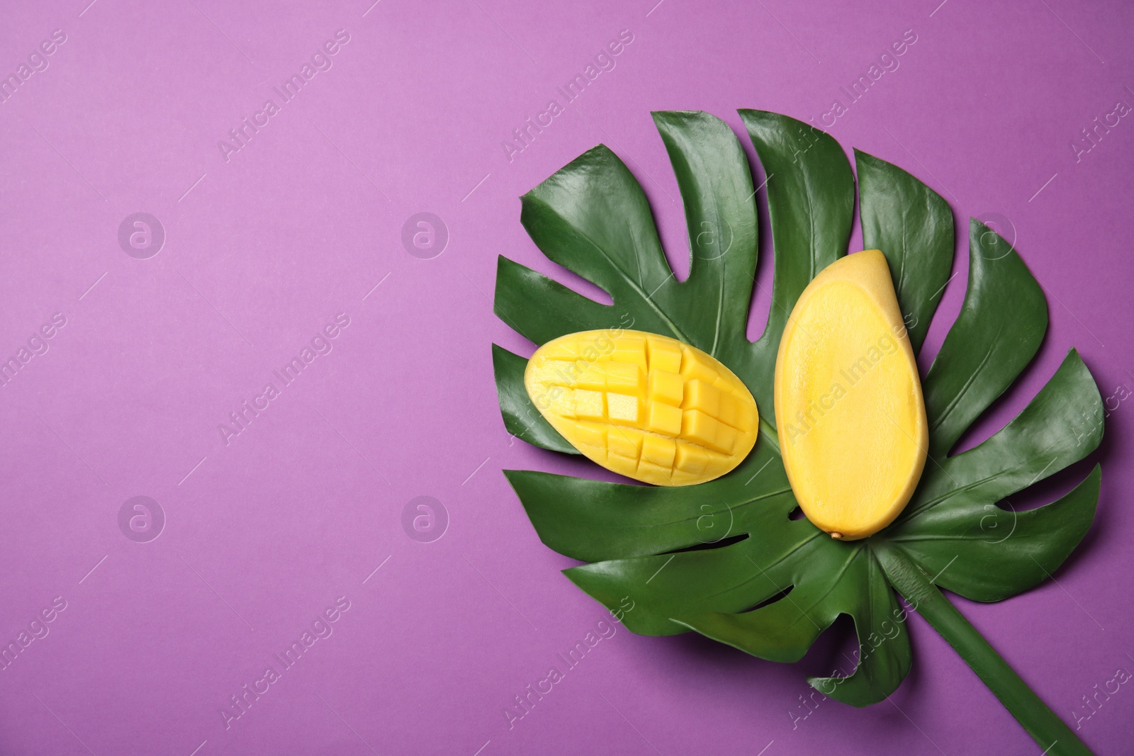 Photo of Flat lay composition with mango on color background. Space for text