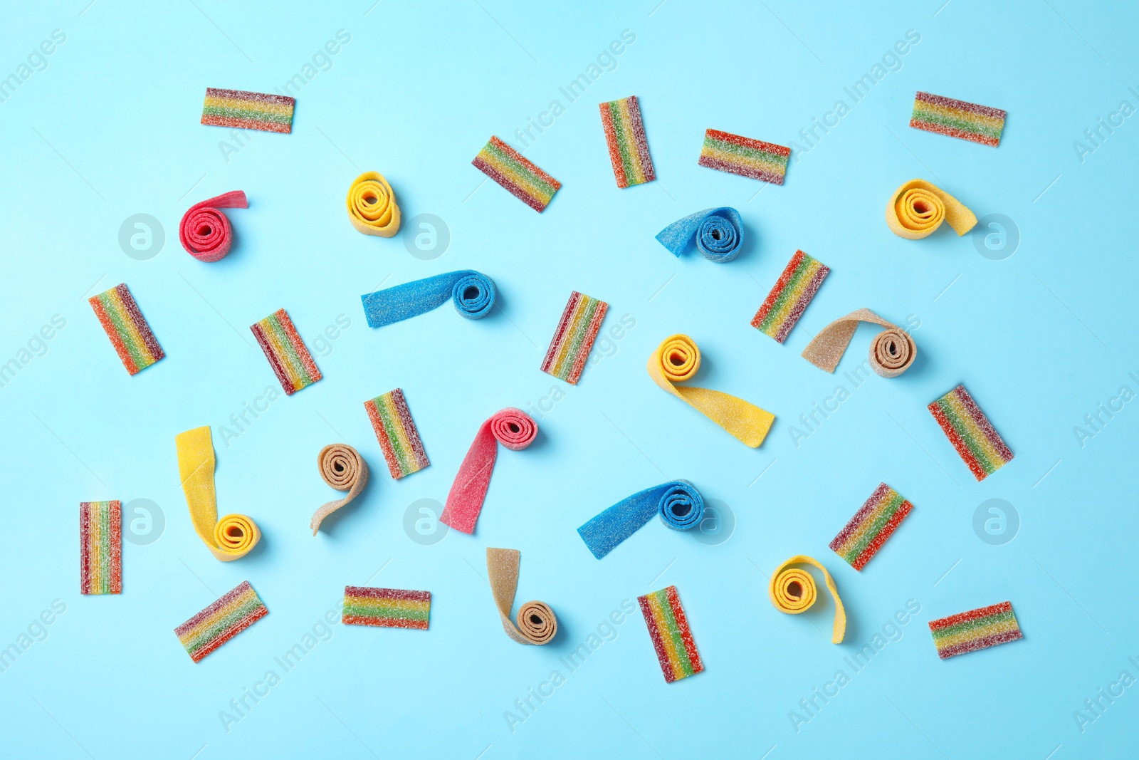 Photo of Flat lay composition with different yummy candies on color background