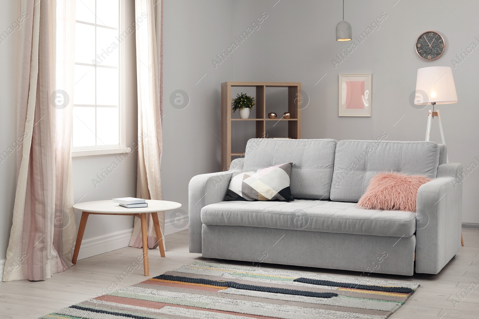 Photo of Modern living room interior with comfortable sofa and beautiful carpet