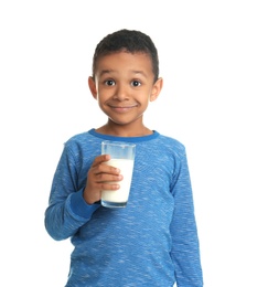 Adorable African-American boy with glass of milk on white background