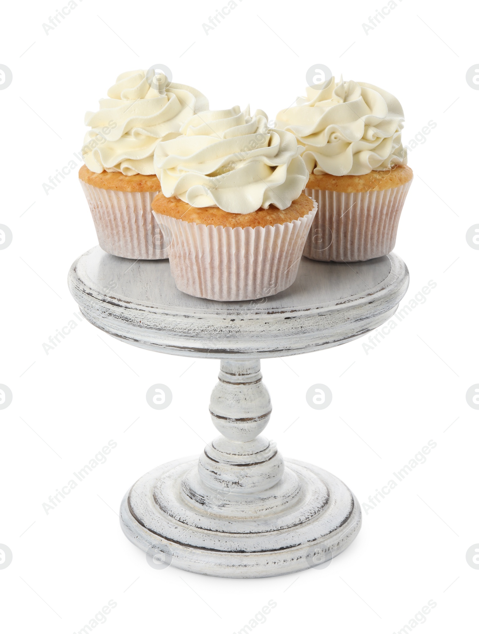 Photo of Tasty vanilla cupcakes with cream isolated on white