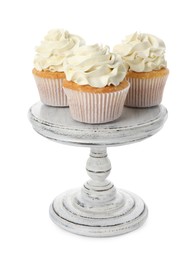 Photo of Tasty vanilla cupcakes with cream isolated on white