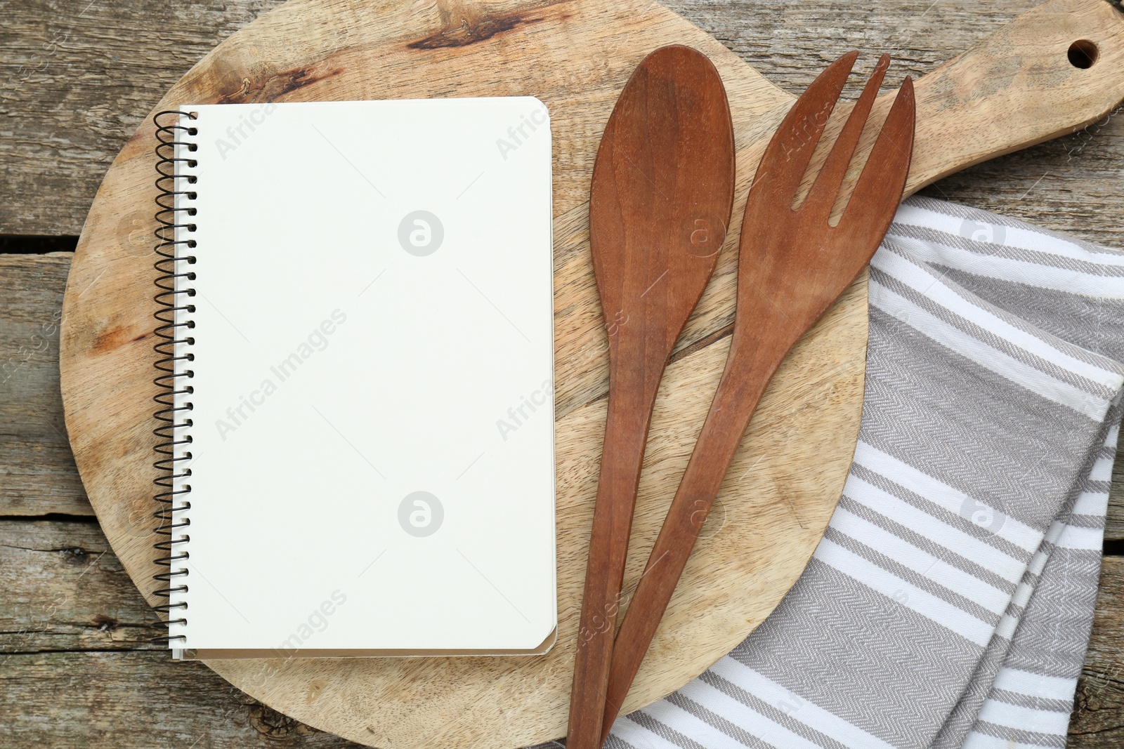 Photo of Blank recipe book and kitchen utensils on old wooden table, flat lay. Space for text