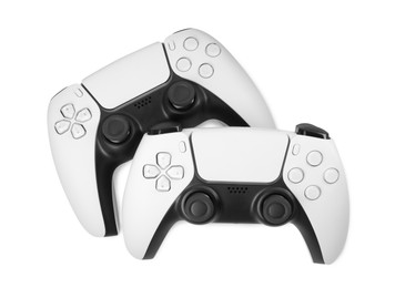 Photo of Two wireless game controllers isolated on white, top view