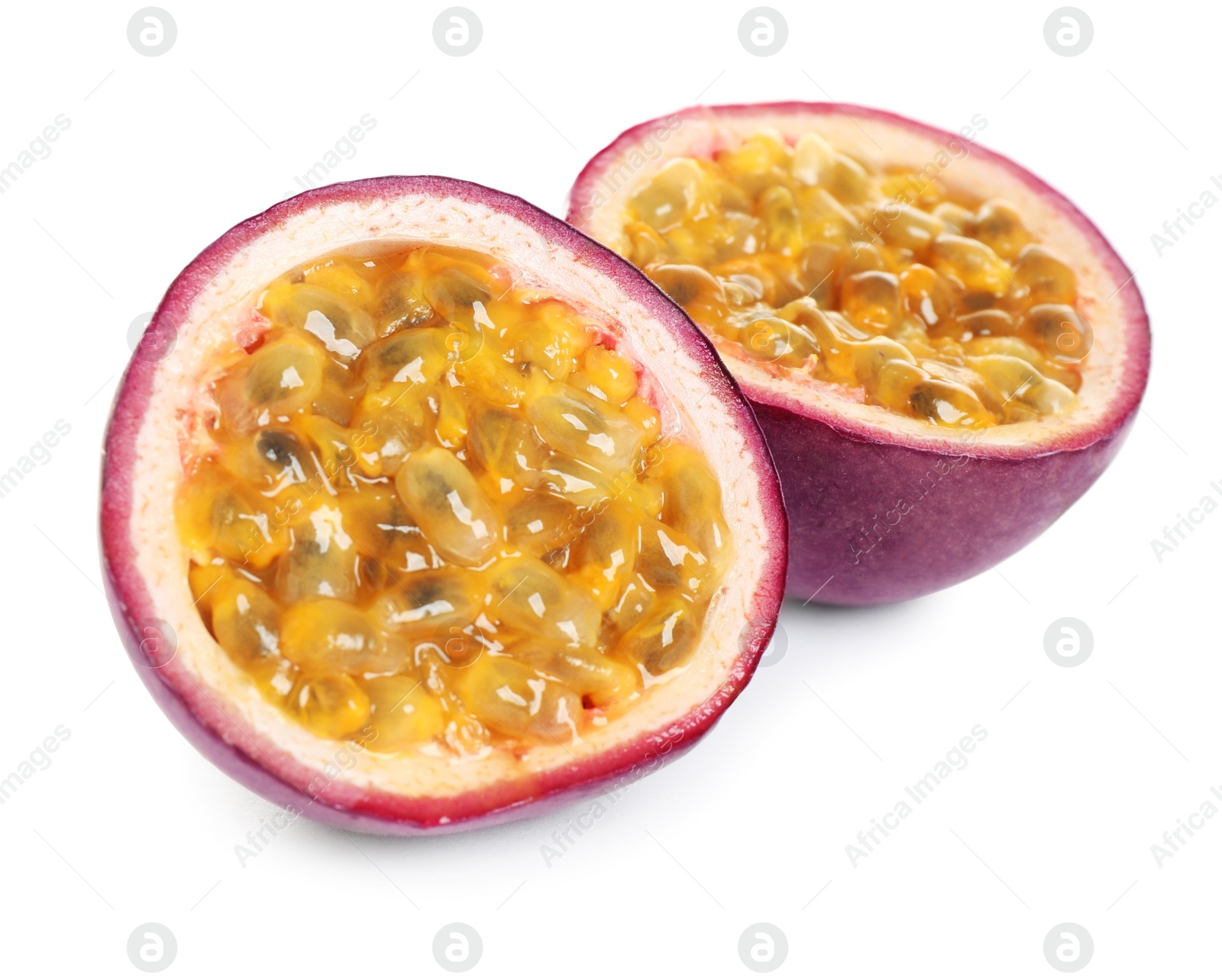 Photo of Halves of fresh ripe passion fruit (maracuya) isolated on white