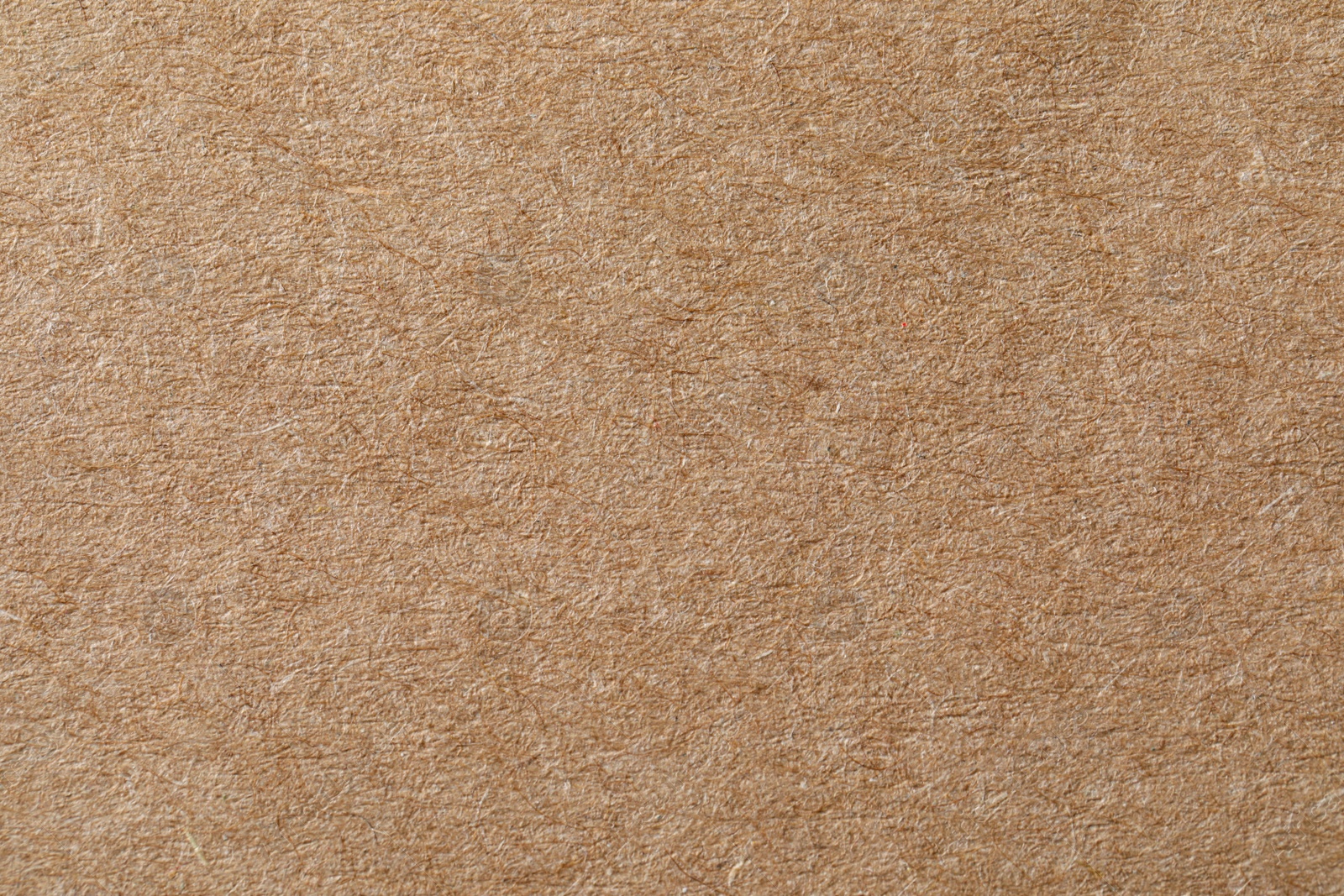 Photo of Texture of kraft paper sheet as background, closeup