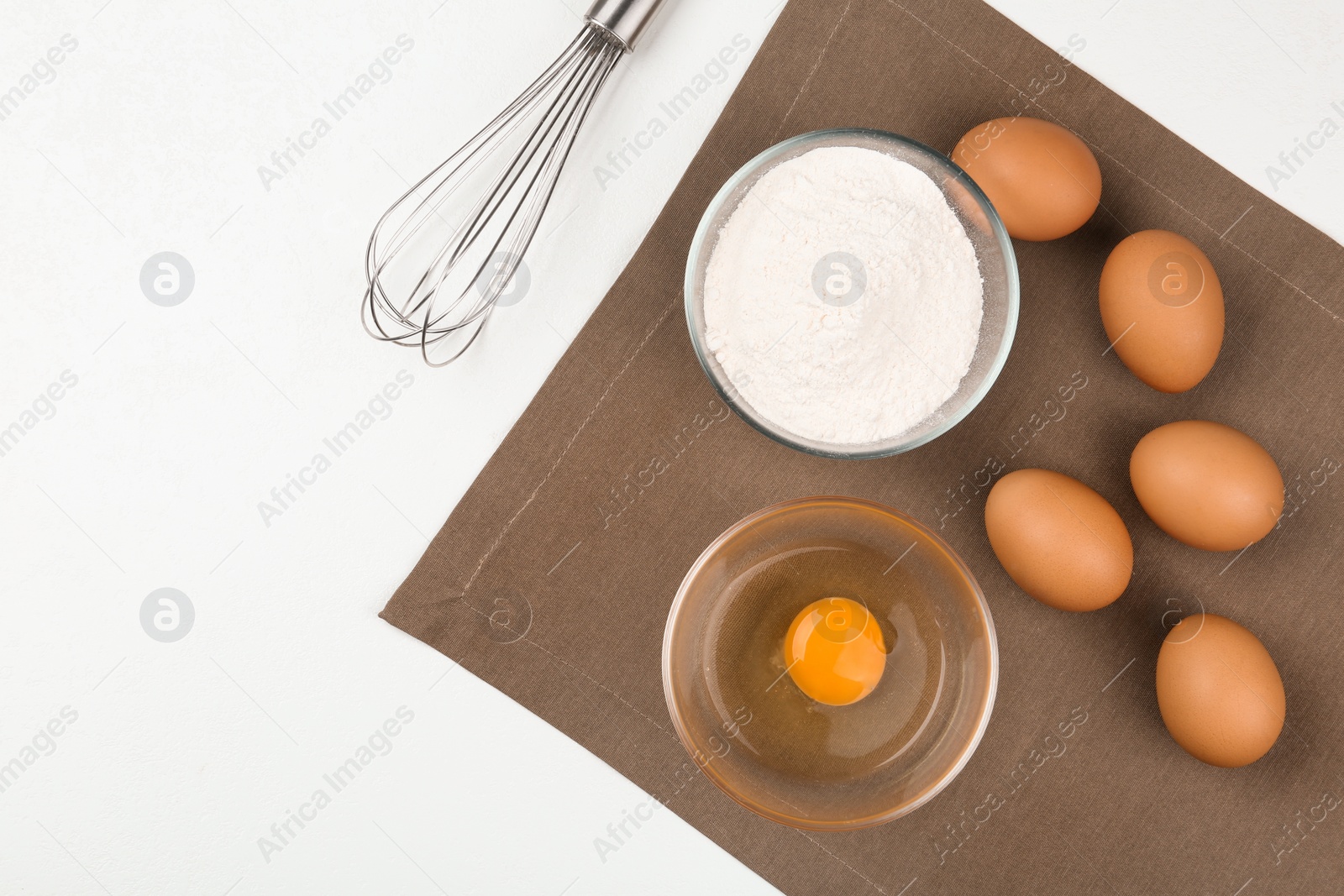 Photo of Flat lay composition with raw eggs and other ingredients on white table. Baking pie