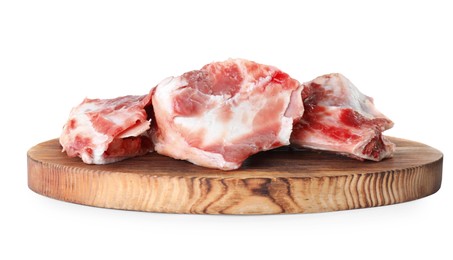 Wooden board with raw chopped meaty bones on white background