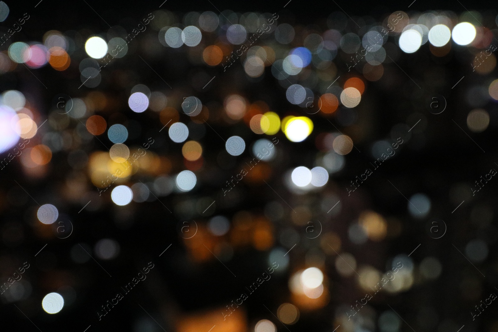 Photo of Blurred view of cityscape at night. Bokeh effect