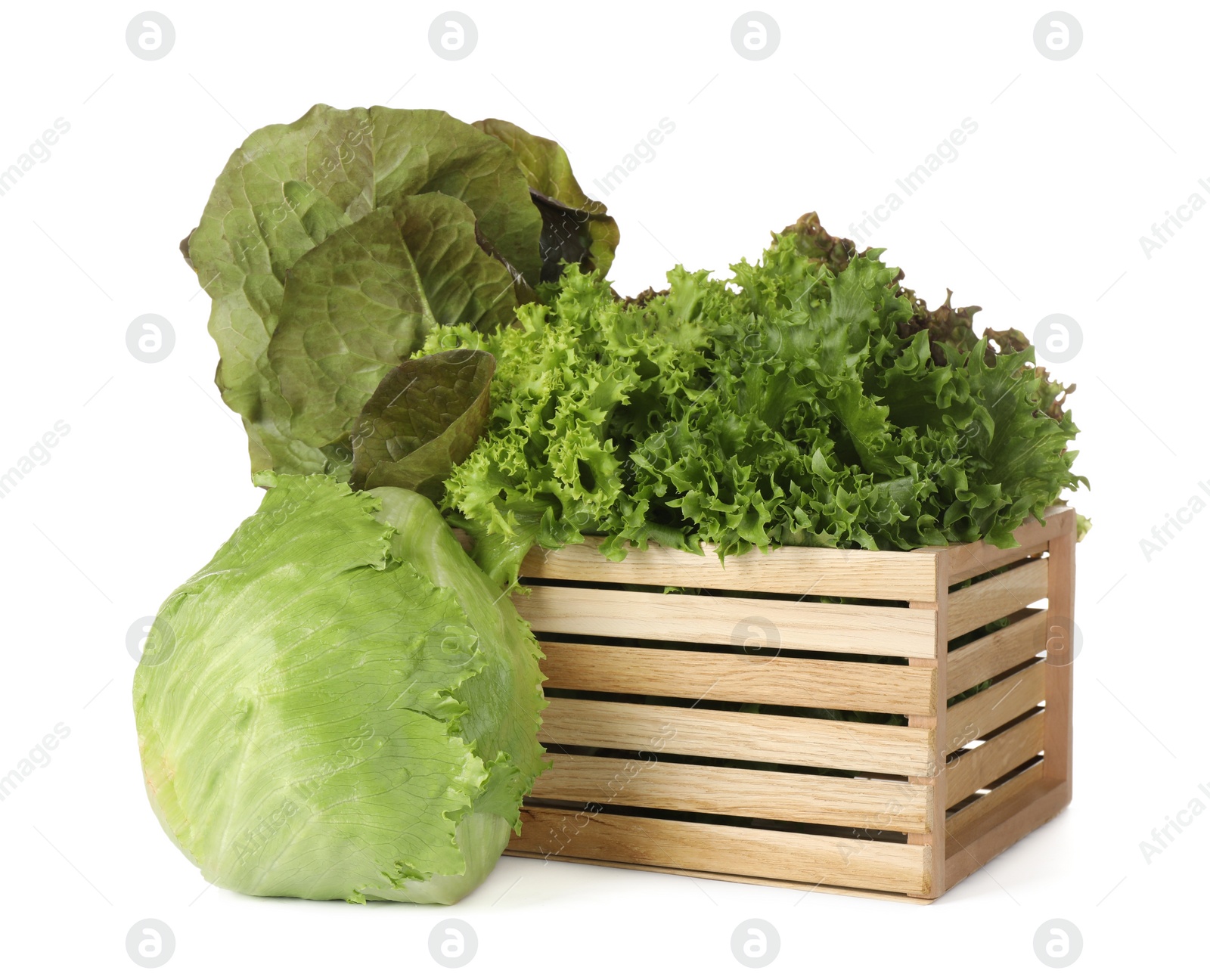 Photo of Wooden crate and different sorts of lettuce on white background