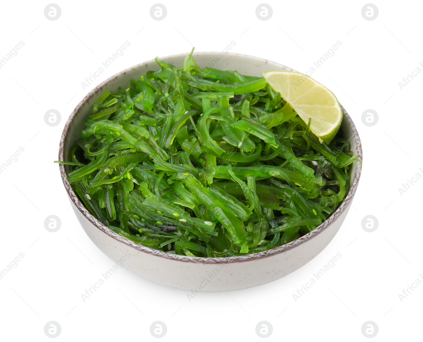 Photo of Tasty seaweed salad in bowl isolated on white