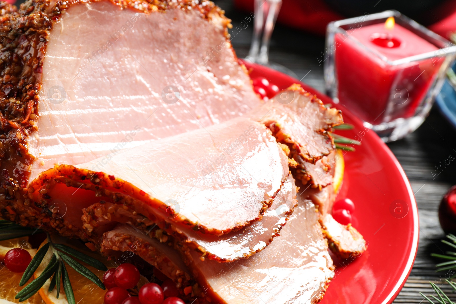 Photo of Plate with delicious ham served on dark wooden table, closeup. Christmas dinner