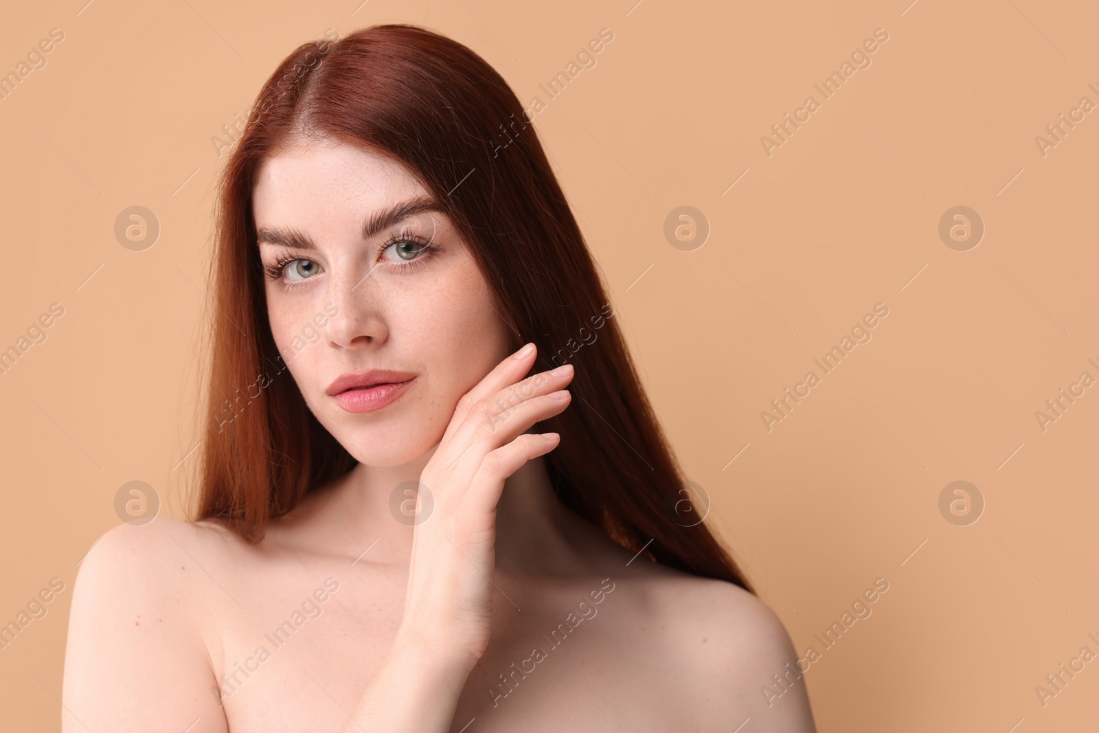 Photo of Portrait of beautiful woman on beige background. Space for text