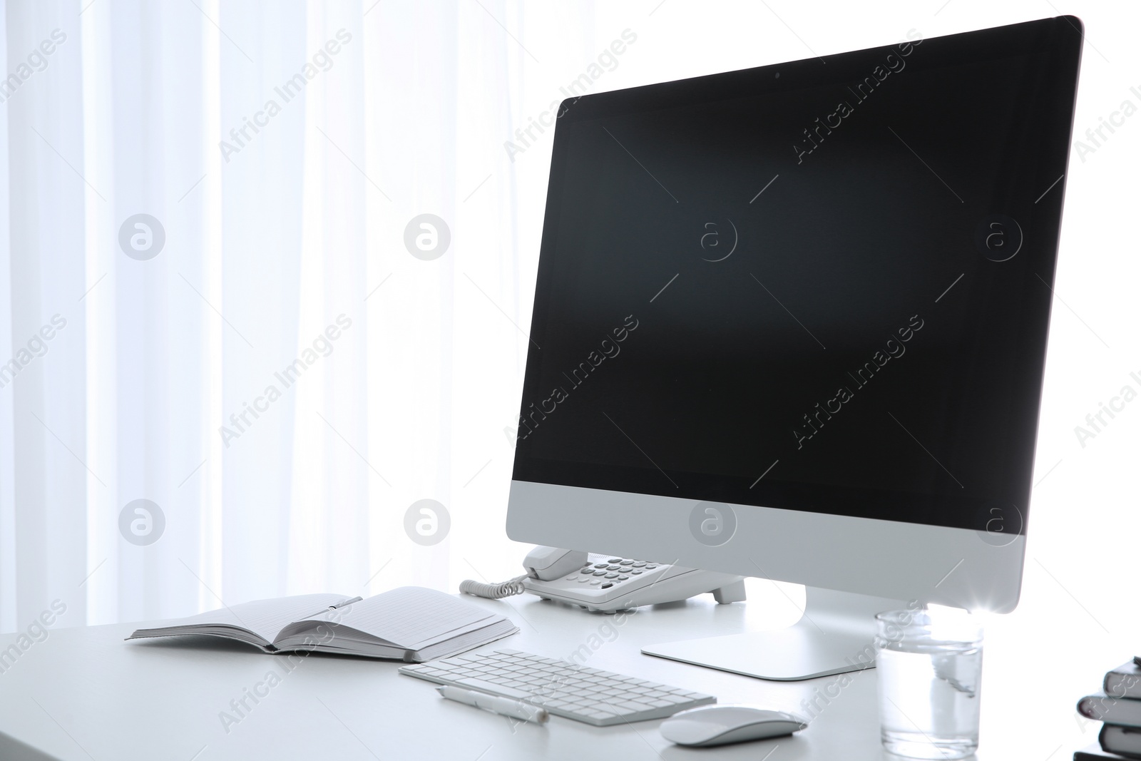 Photo of Stylish workplace with modern computer on desk