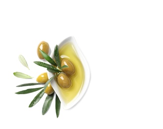 Photo of Dish with oil, olives and leaves on white background