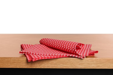 Photo of Checkered tablecloth on wooden table against white background