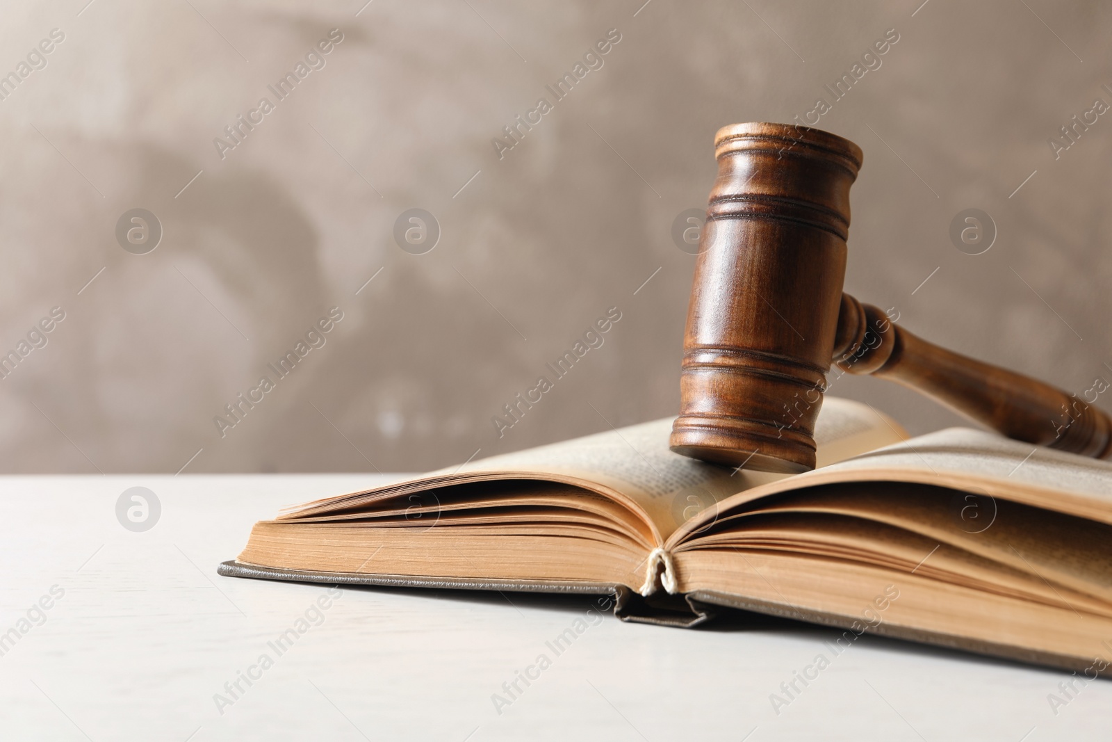 Photo of Wooden gavel and book on table. Law concept