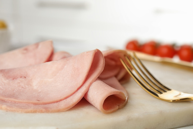 Photo of Slices of tasty ham on table, closeup